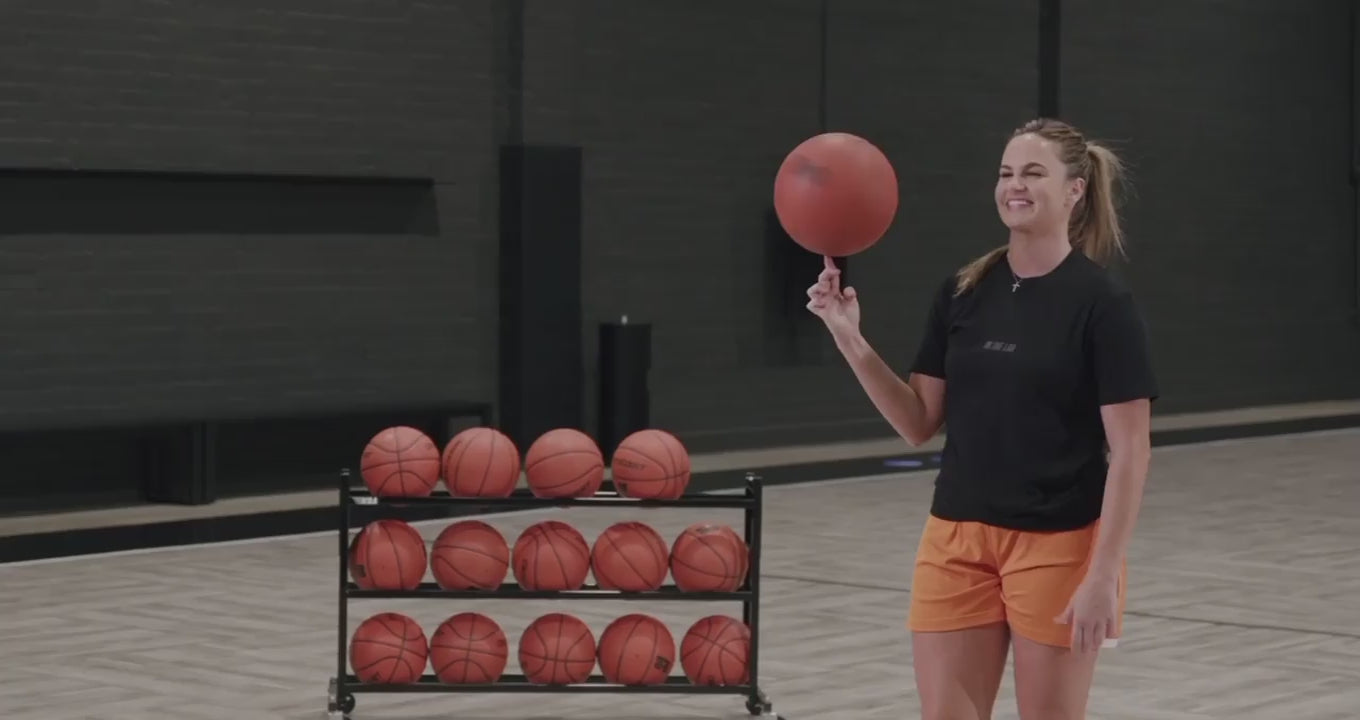 Load video: Basketball trainer leading a workout.