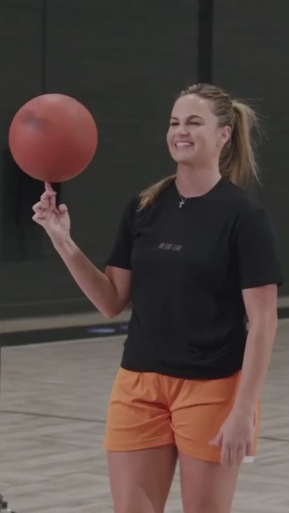 Load video: Basketball trainer leading a workout.